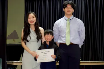 Student receiving a certificate at Horizon Music Academy