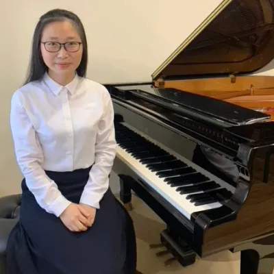 Ms Charity, founder and piano instructor